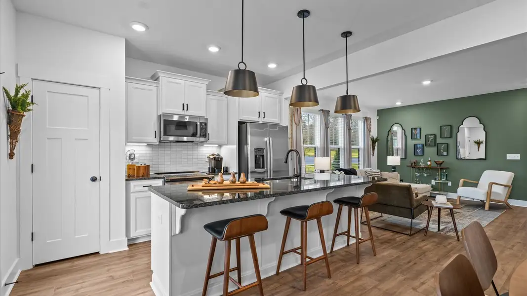 Exceptional kitchen featuring a spacious island, eye-catching pendant lights, and modern finishes in Simpsonville, SC Exceptional kitchen featuring a spacious island, eye-catching pendant lights, and modern finishes in Simpsonville, SC