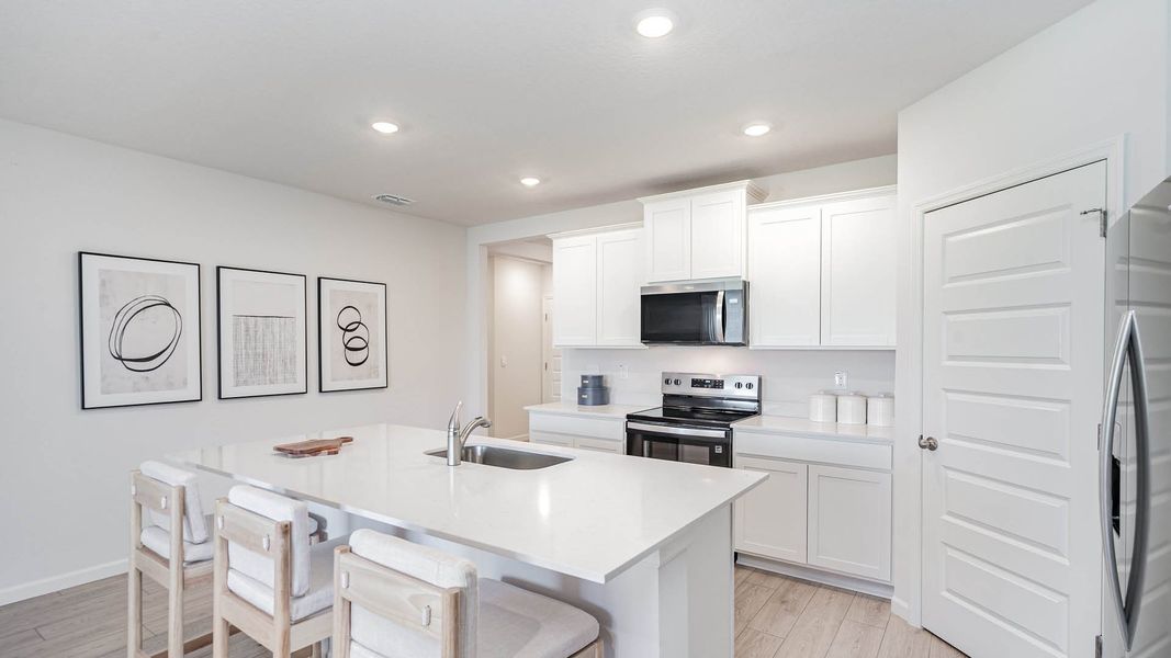 Furnished interior in a model home at Okeechobee Spot Lots in Okeechobee (Image 3).