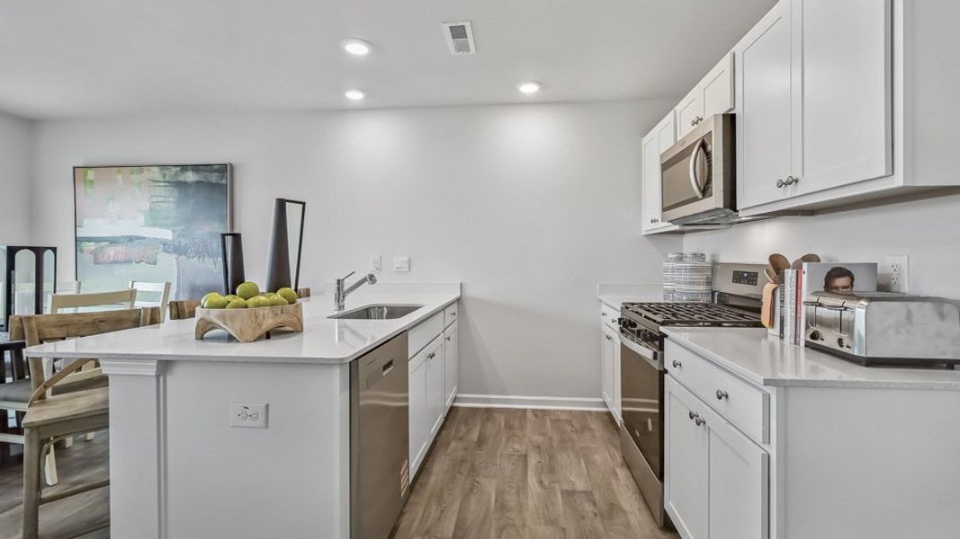 Furnished interior in a model home at The Townes at Honeycutt Oaks in Angier (Image 27).