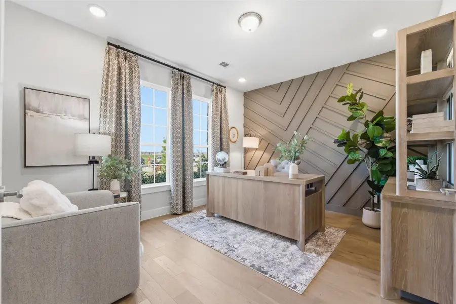 Furnished interior in a model home at Ashland in Angleton (Image 5).