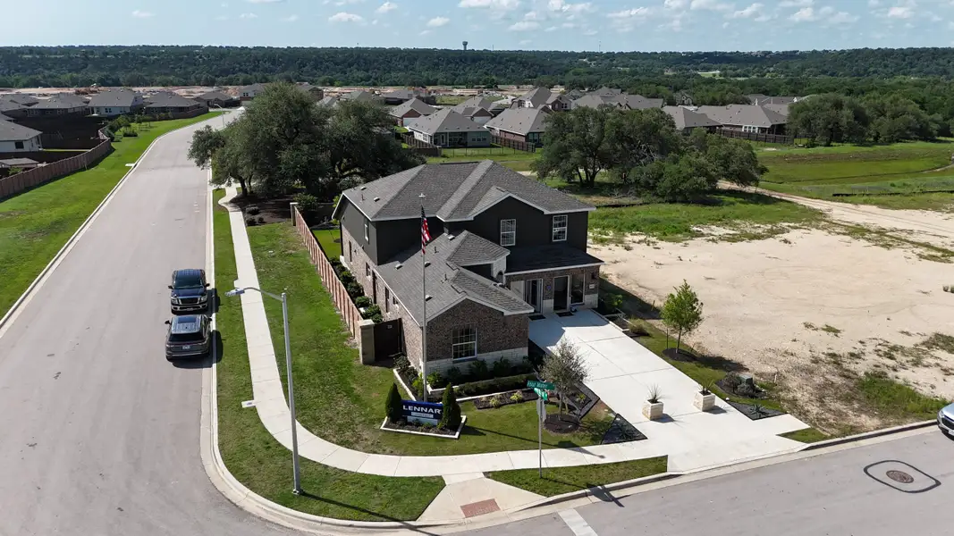 A charming brick home with a landscaped yard in Lively Ranch: Claremont Collection by Lennar (Georgetown, TX).