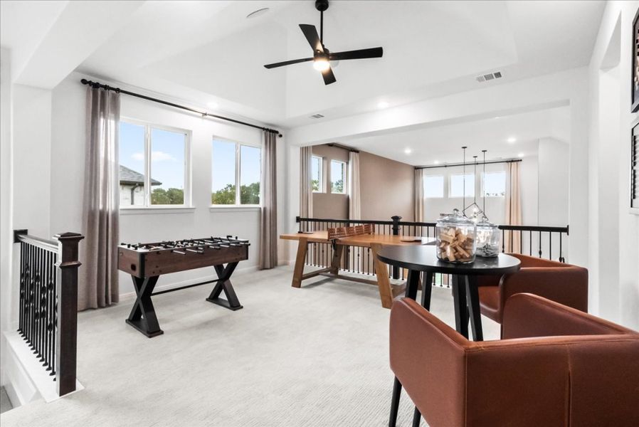 Furnished interior in a model home at The Reserve at Spiritas Ranch in Little Elm (Image 30).