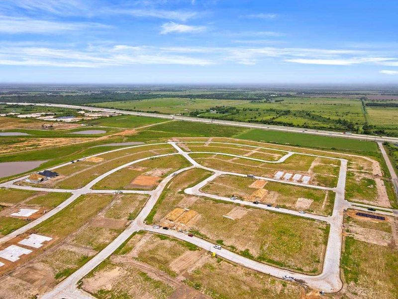 Aerial view of the Brookewater community in Rosenberg, TX, showing layout and nearby surroundings (Image 1).