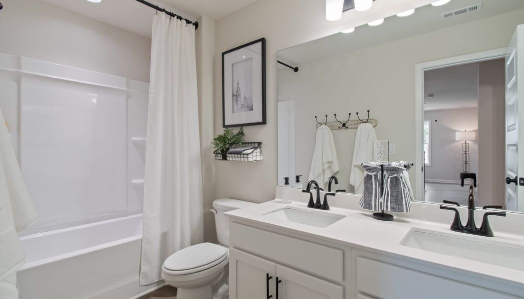 Furnished interior in a model home at Kentmere in Auburn (Image 39).