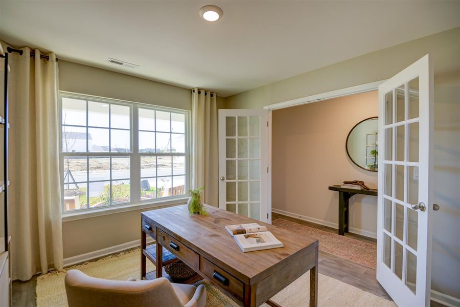 Furnished interior in a model home at Corinth Village in Greensboro (Image 23).
