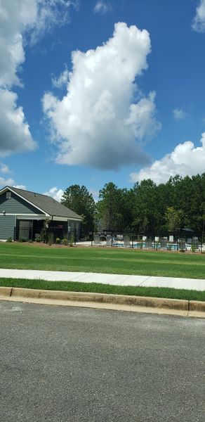 A charming community pool with a cozy clubhouse in Sandtown Falls by Rockhaven Homes, nestled in Atlanta, GA. A charming community pool with a cozy clubhouse in Sandtown Falls by Rockhaven Homes, nestled in Atlanta, GA.