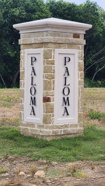 Entrance to the Paloma Ranches community in Justin, TX, featuring signage and landscaping (Image 10).