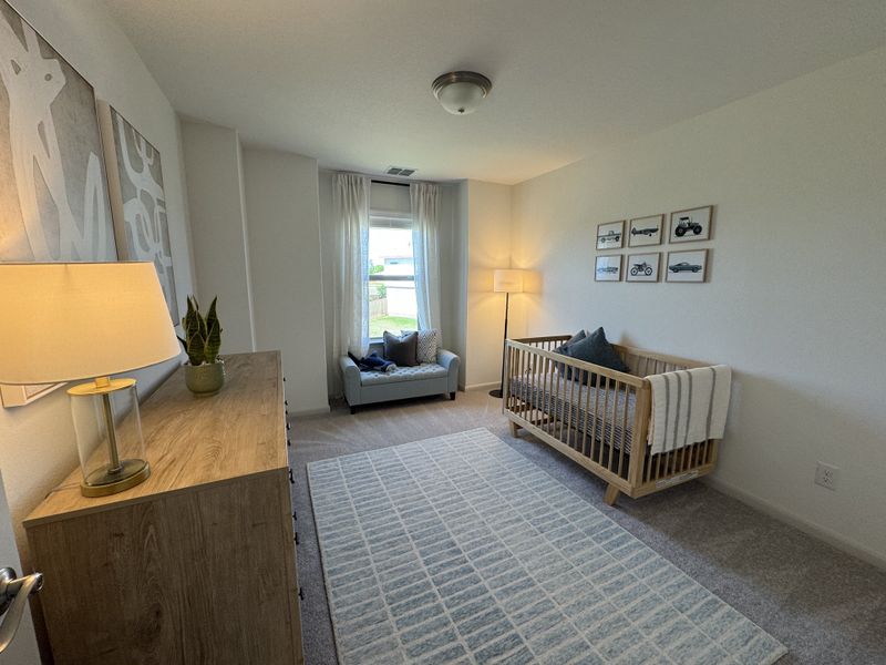 A cozy nursery with a wooden crib, soft armchair, and modern art. Plush carpet and gentle lighting create a serene atmosphere. A cozy nursery with a wooden crib, soft armchair, and modern art. Plush carpet and gentle lighting create a serene atmosphere.