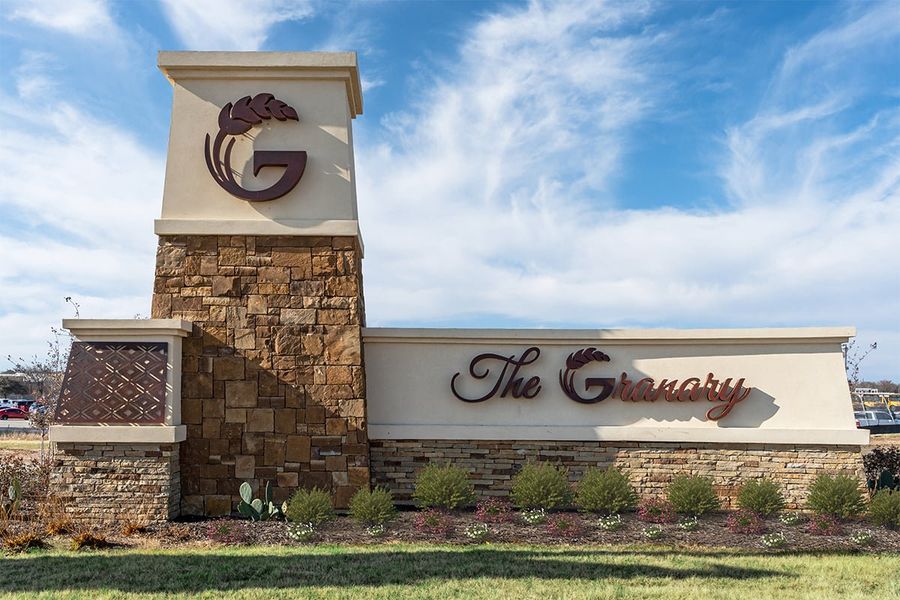 Entrance to the The Granary - Sterling Collection community in San Antonio, TX, featuring signage and landscaping (Image 1). Entrance to the The Granary - Sterling Collection community in San Antonio, TX, featuring signage and landscaping (Image 1).