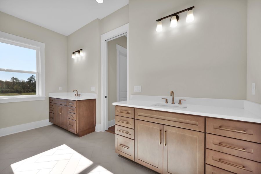 Furnished interior in a model home at Hidden Creek at SilverLeaf in St. Augustine (Image 31).