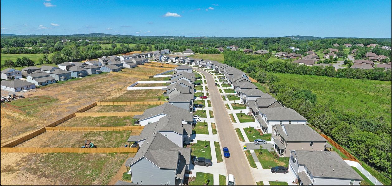 A large area with many buildings and trees in the background. A large area with many buildings and trees in the background.