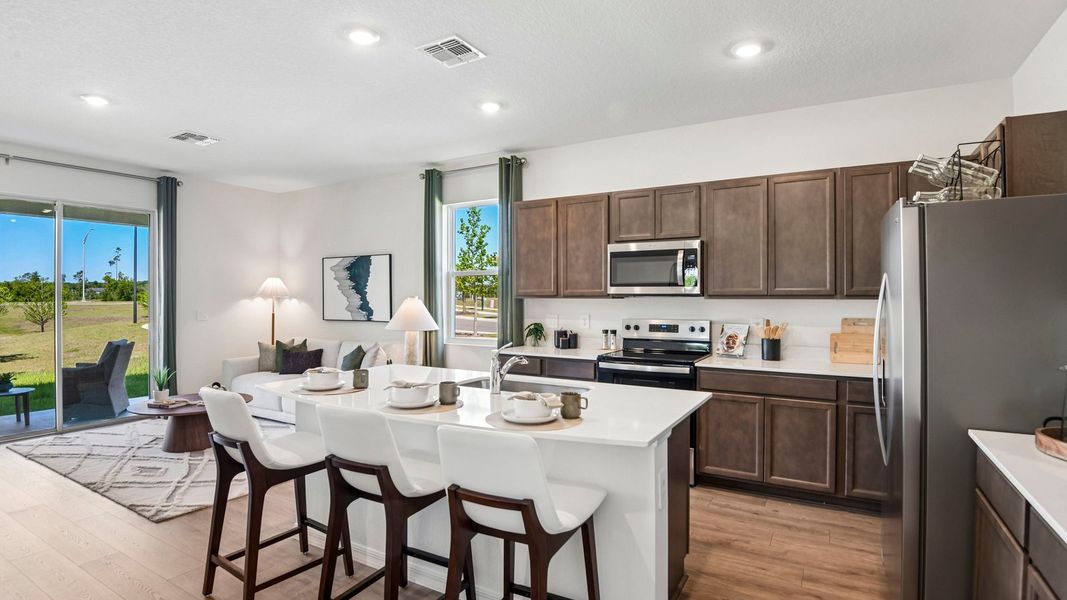 Furnished interior in a model home at Sanctuary at Citrus Park Townhomes in Tampa (Image 11).