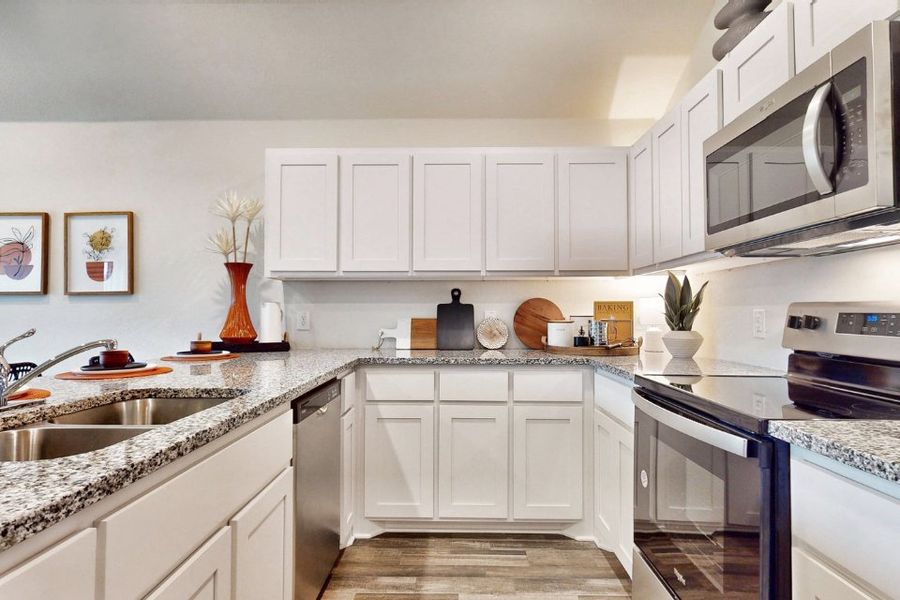A kitchen with white cabinets. A kitchen with white cabinets.