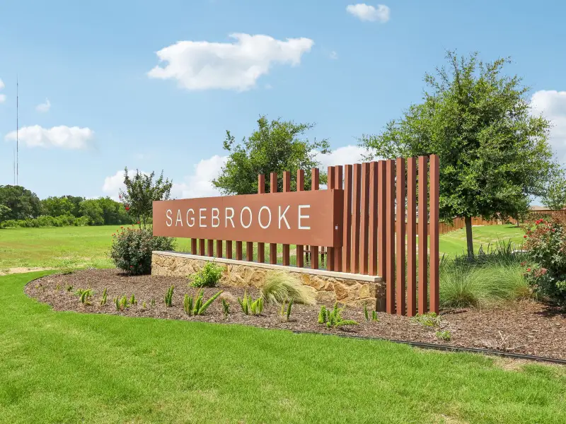 Entrance to the Sagebrooke - Classic Series community in San Antonio, TX, featuring signage and landscaping (Image 1). Entrance to the Sagebrooke - Classic Series community in San Antonio, TX, featuring signage and landscaping (Image 1).