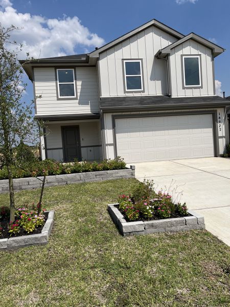 A modern two-story home with landscaped yard in Sunset Valley by D.R. Horton (Hockley, TX).
