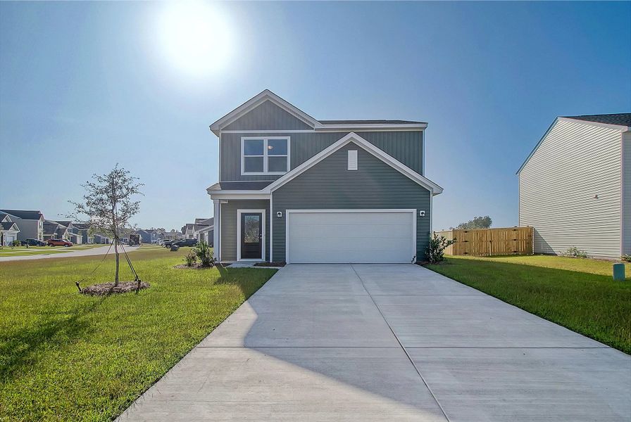 Front exterior of a home in the Tea Farm: Lake Series community, located in Ravenel, SC (Image 2).