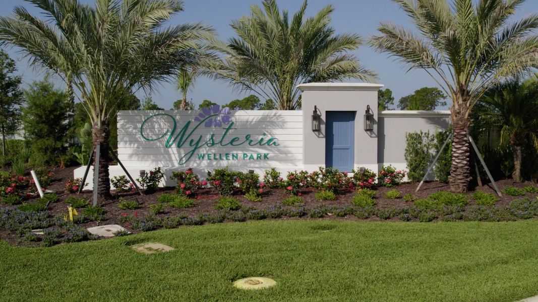 Entrance to the Wysteria community in Venice, FL, featuring signage and landscaping (Image 2).