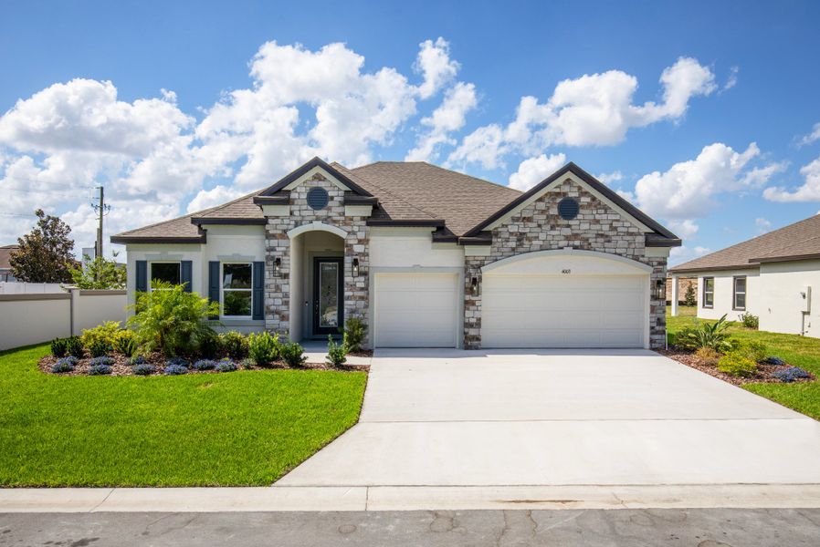 Front exterior of a home in the Lehigh Acres Premier community, located in Lehigh Acres, FL (Image 2). Front exterior of a home in the Lehigh Acres Premier community, located in Lehigh Acres, FL (Image 2).