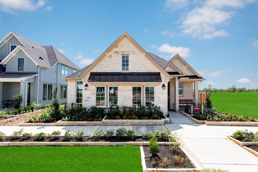Front exterior of a home in the Madeley Creek community, located in Conroe, TX (Image 2).