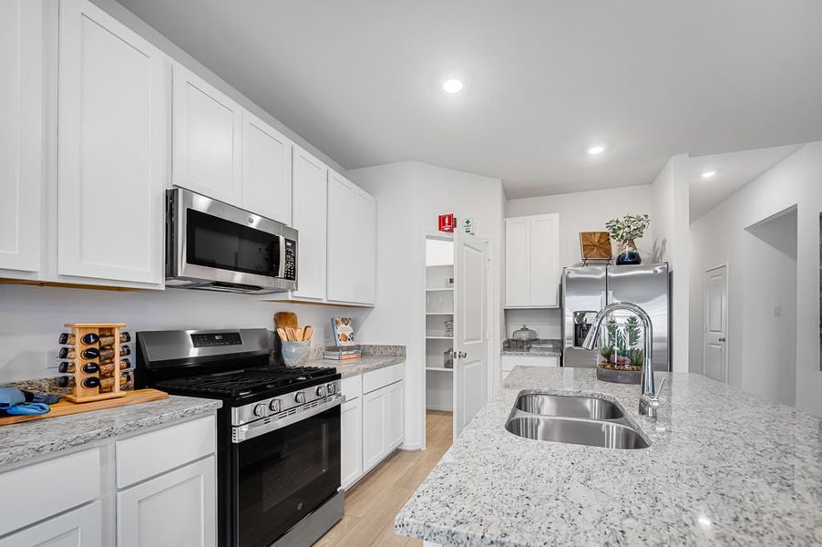 Furnished interior in a model home at Raburn Reserve 50s in Tomball (Image 29).