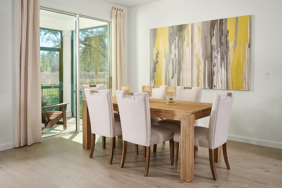 Dining area of the Orchid plan modeled at Lakes at Bella Lago.