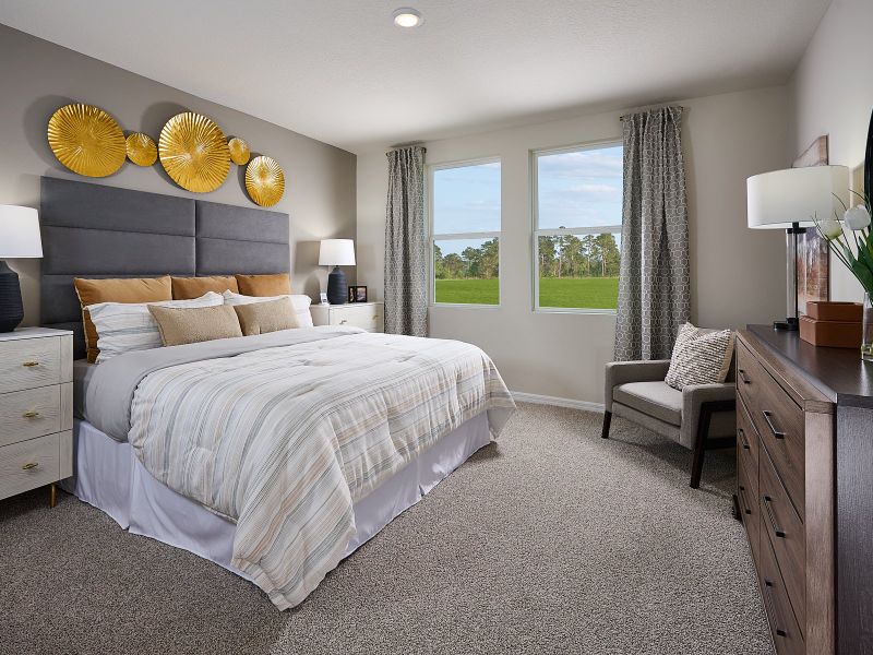 Primary bedroom of the Acadia floorplan modeled at Park East.