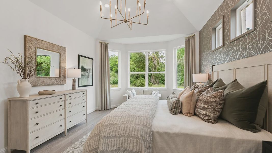 Experience opulent design with grand windows, a modern chandelier, and bespoke wallpaper in Katy Lakes. Experience opulent design with grand windows, a modern chandelier, and bespoke wallpaper in Katy Lakes.