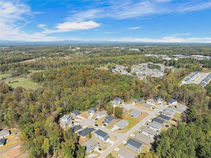 Aerial view of the Magnolia Villas community in Cornelia, GA, showing layout and nearby surroundings (Image 3).