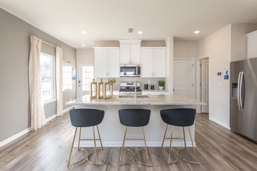 Take a look at the entrance of the home and discover the tastefully crafted kitchen.