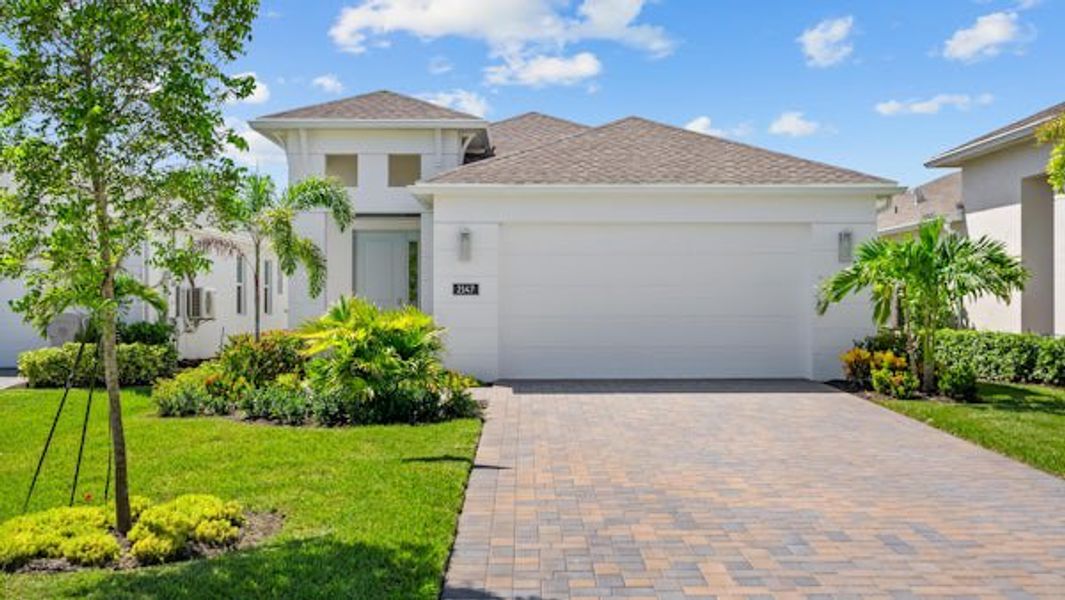 Front exterior of a home in the The Falls at Grand Harbor community, located in Vero Beach, FL (Image 45).