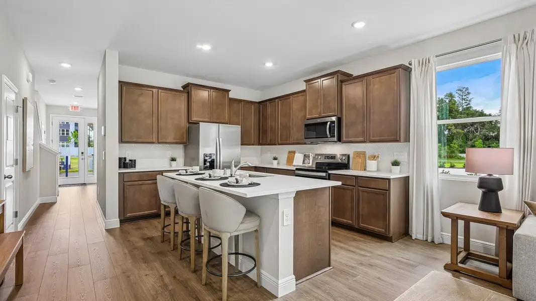 Furnished interior in a model home at Sanctuary at Citrus Park Townhomes in Tampa (Image 5).