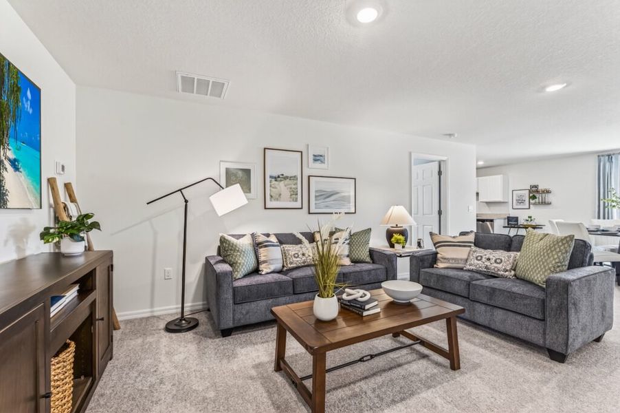 Furnished interior in a model home at Mallard Landing in Okeechobee (Image 3).
