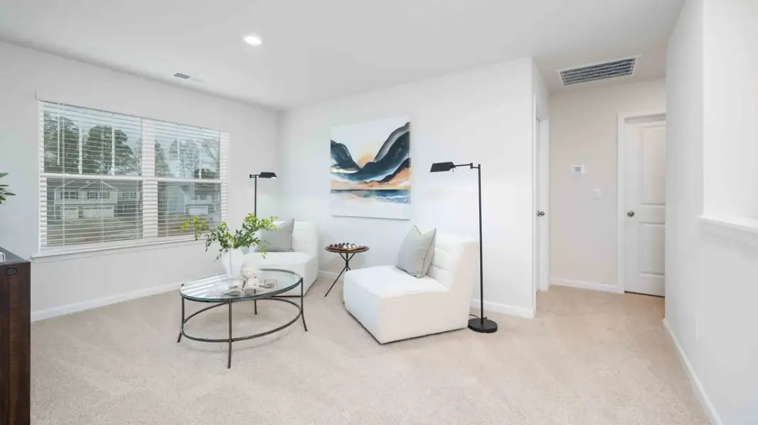 Furnished interior in a model home at Sweetwater Village in Rockwell (Image 24).