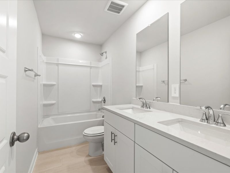 Furnished interior in a model home at Chatham Forest in Duncan (Image 9).