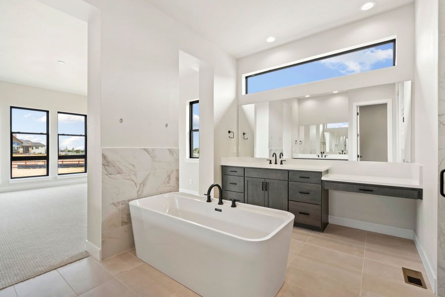 Furnished interior in a model home at Acadia at RainDance in Windsor (Image 18).
