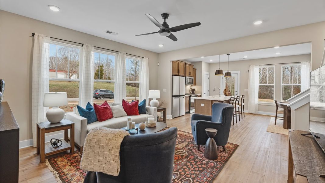 Colorfully decorated family room in two story townhome at Hickory Heights by DRB Homes near Downtown Greenville, SC