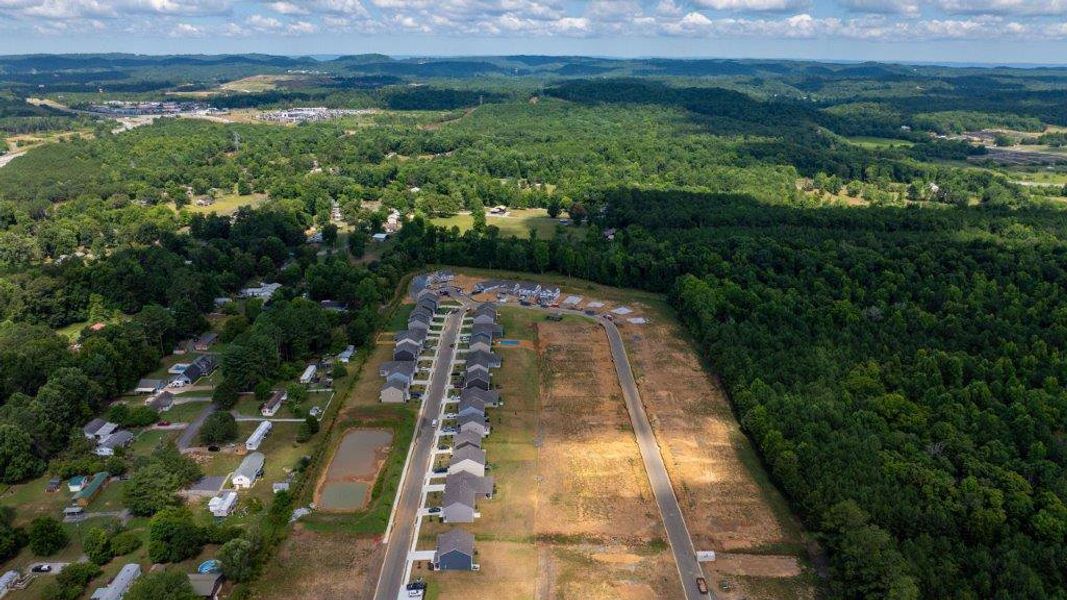 Aerial view of the Hillcrest Landing community in McDonald, TN, showing layout and nearby surroundings (Image 1).