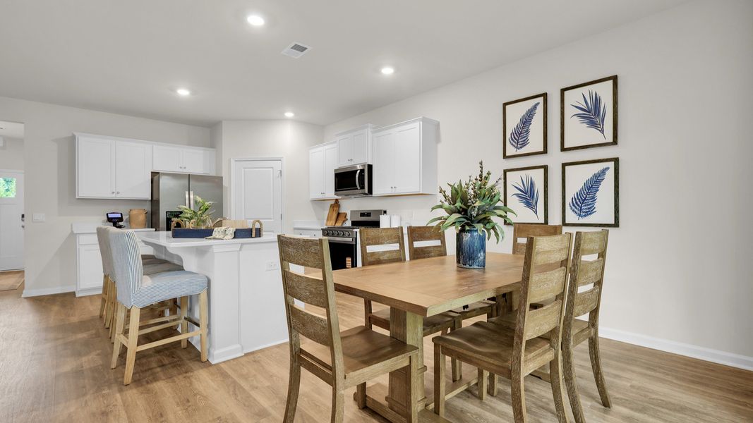 Furnished interior in a model home at The Cove at Mallard Crossing in Summerville (Image 14).