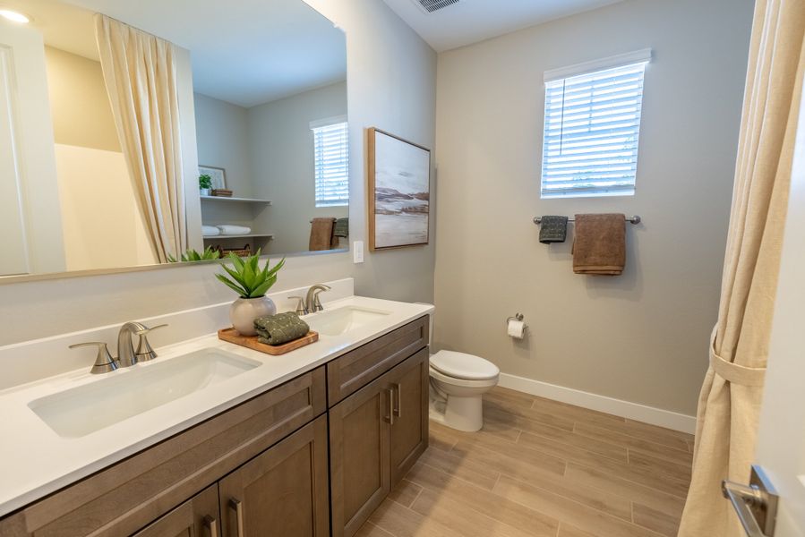 Furnished interior in a model home at Blossom Rock Reserve Series in Apache Junction (Image 25).