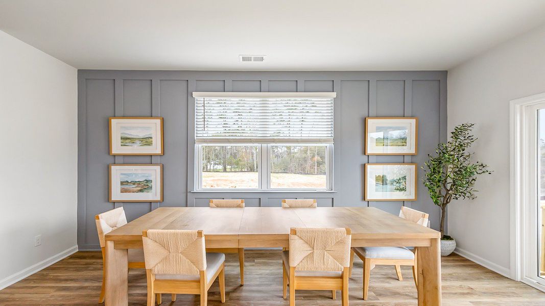 Furnished interior in a model home at The Crossing at St. James in Summerville (Image 6).