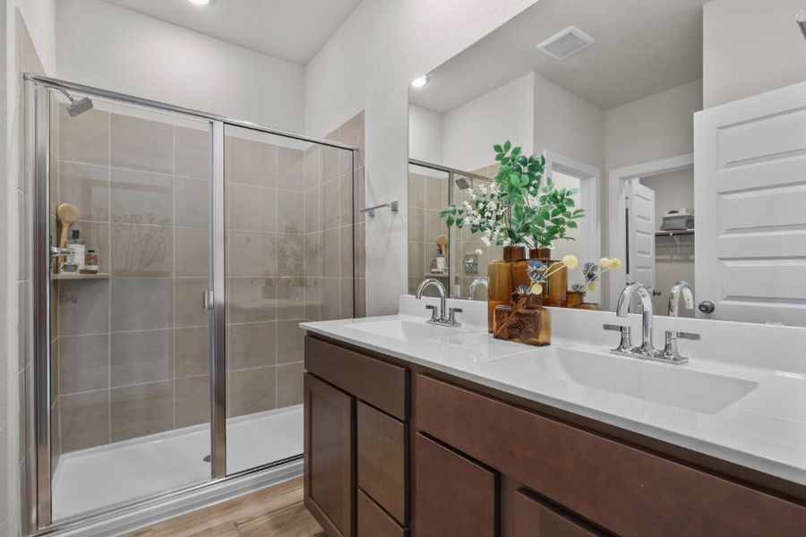 A bathroom with a glass shower.