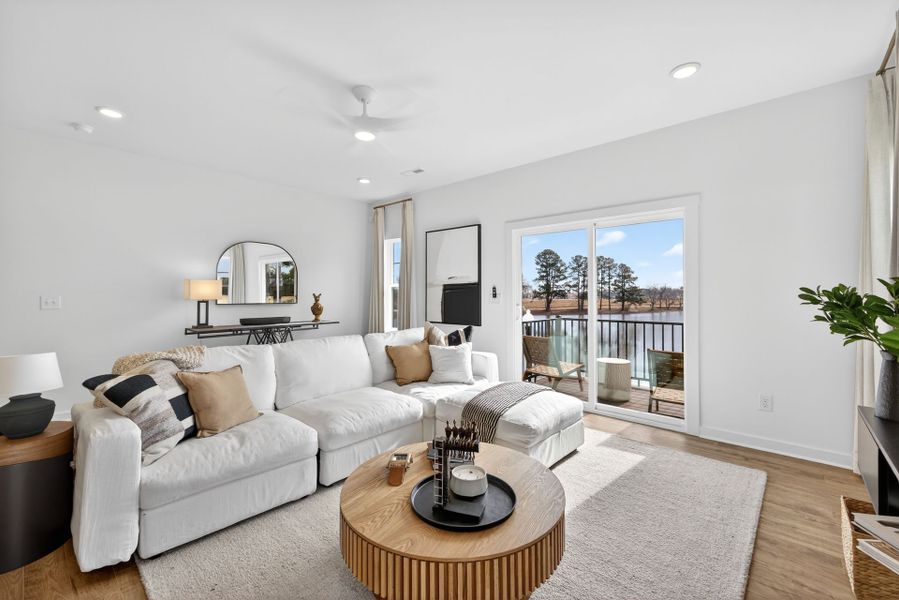 Furnished interior in a model home at North District at Flowers Plantation Townhomes in Clayton (Image 6).