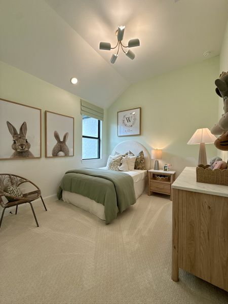 A cozy bedroom with soft lighting, playful bunny art, and warm, neutral decor. A cozy bedroom with soft lighting, playful bunny art, and warm, neutral decor.