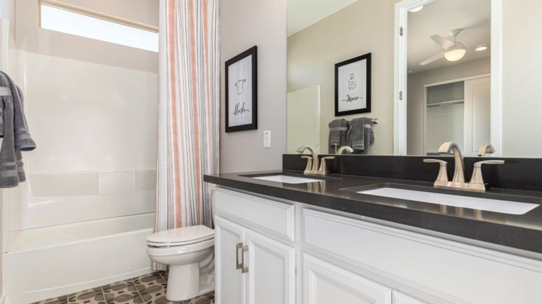 Furnished interior in a model home at Alamar Encore Collection in Avondale (Image 51).