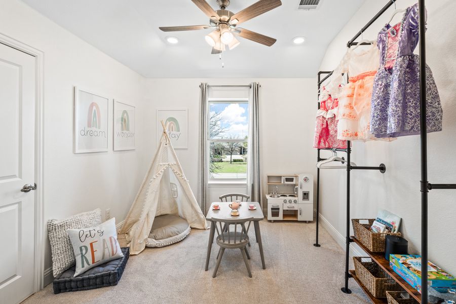 Furnished interior in a model home at Lake Pointe in Little Elm (Image 13).