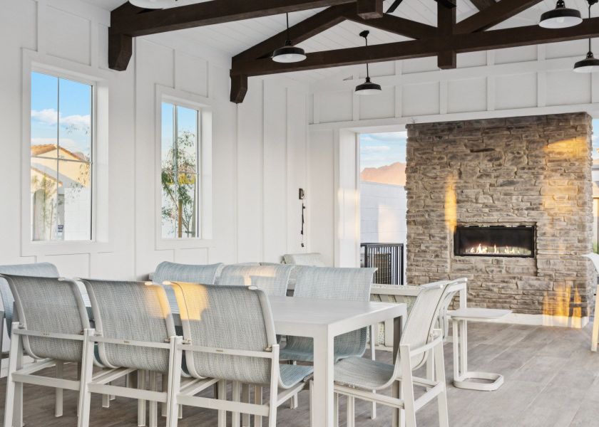 A room with a fireplace and chairs. A room with a fireplace and chairs.