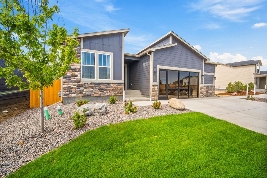 Front exterior of a home in the The Glen-12 community, located in Colorado Springs, CO (Image 8).