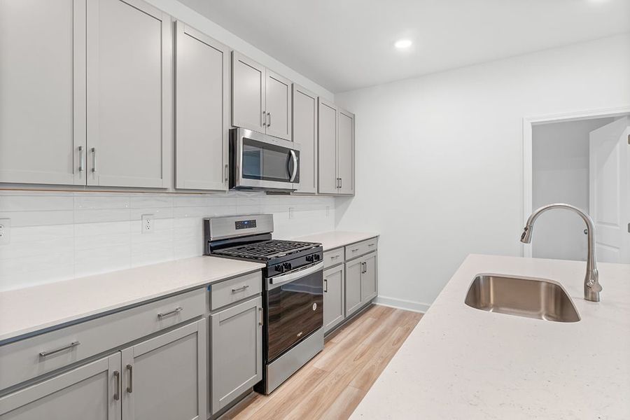 A kitchen with white cabinets. A kitchen with white cabinets.