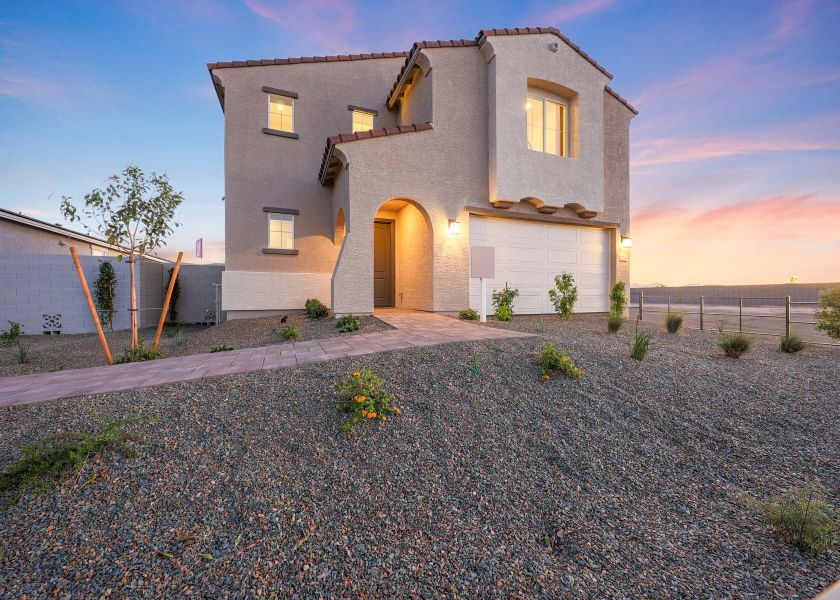 A house with a gravel driveway. A house with a gravel driveway.