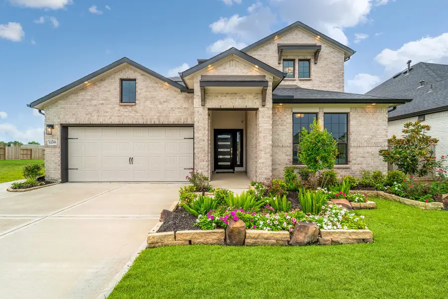 Front exterior of a home in the Mulberry Farms community, located in Santa Fe, TX (Image 2).